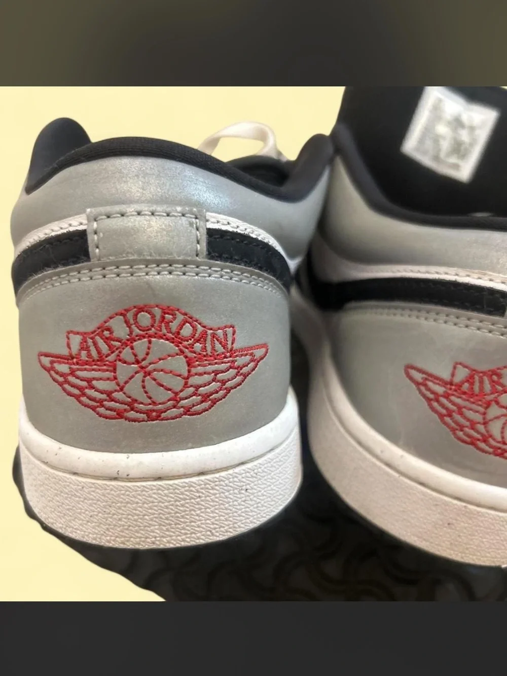 Nike Air Jordan 1 Low Black Metallic sneakers with black, white, red